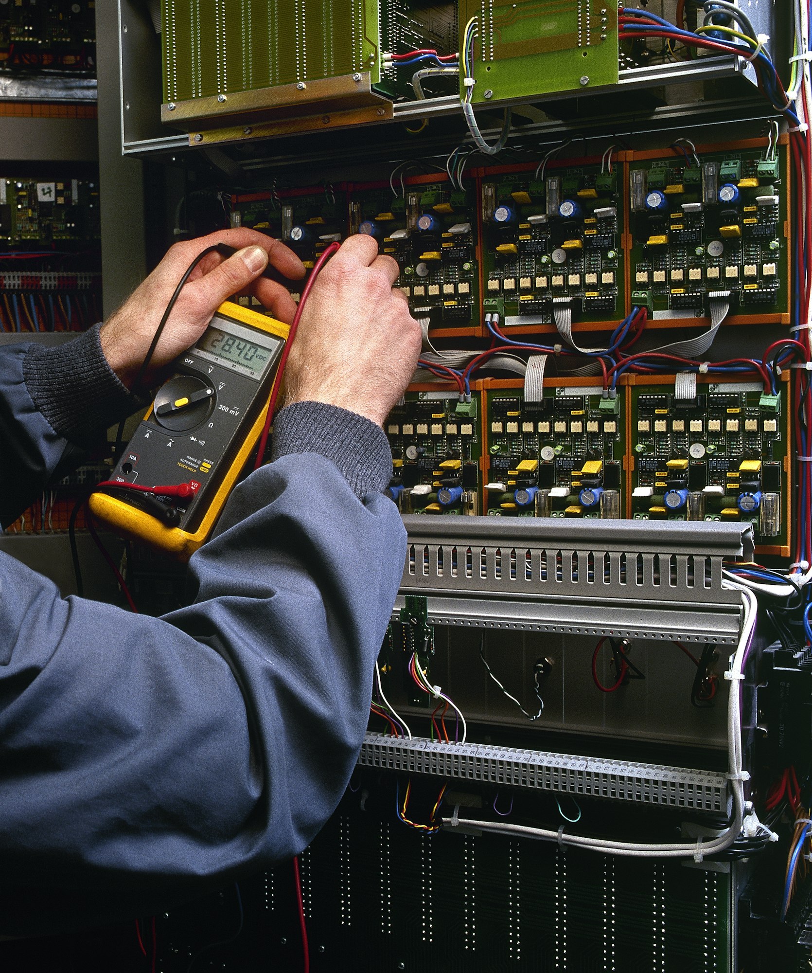 electrician testing industrial machine